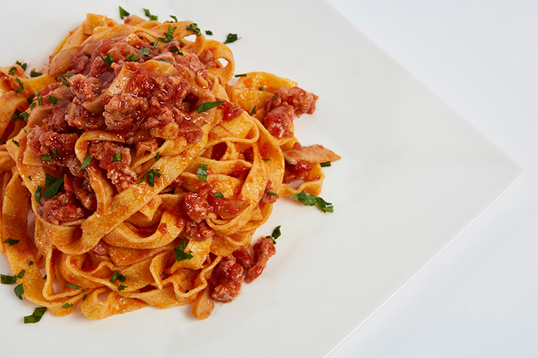 Fettuccine with bolognese ragout and mushrooms